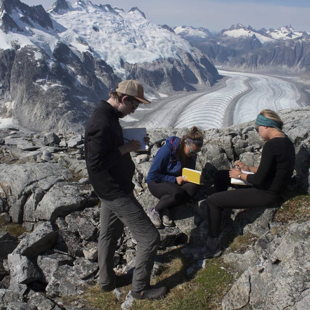 Geoscienctists sampling on a glacier